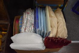 A box of mixed materials including bed linen and curtains