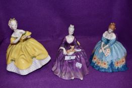 A selection of Royal Doulton figurines including Victoria, Charlotte and Last Waltz