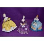 A selection of Royal Doulton figurines including Victoria, Charlotte and Last Waltz