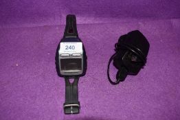 A modern sports running watch by Garmin the Forerunner 205 with charger and cradle