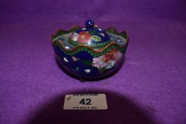 A cloissone enamel decorated korro decorated with peonies having three footed base AF with slight