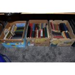 A selection of text and reference books over three boxes