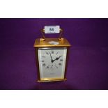 A brass cased carriage clock by HOF Switzerland