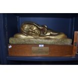An early 20th century cast sculpture of a resting girl titled Mary on oak plinth by Peggie A E