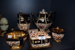 An Imari pattern tea set having hand decorated design teapot AF other pieces good