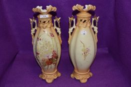 A pair of Austrian bisque mantle vases marked RH to base