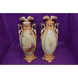 A pair of Austrian bisque mantle vases marked RH to base