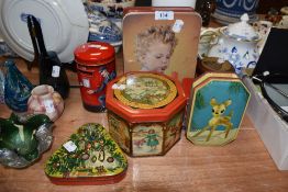 A selection of transfer printed advertising tins including Bambi style deer