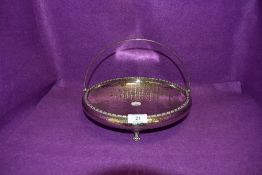 A hammered and plated handled fruit bowl by Pleasance and Harper