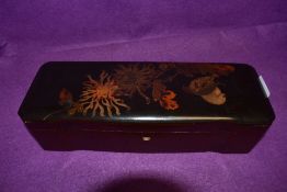 A Japan lacquer glove box or similar decorated with birds and flowers