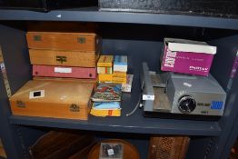 A selection of photographic slides and Boots super 300 model ii projector