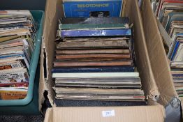 A selection of vinyl records and albums including pop and rock interest