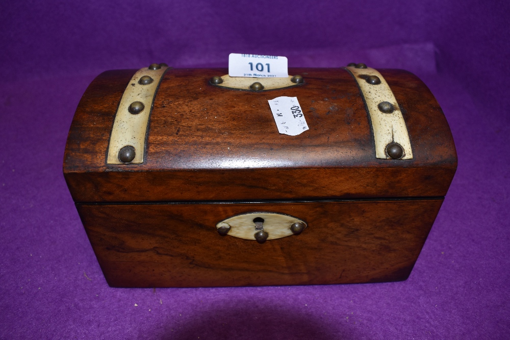 An antique mahogany cased with bone and brass stud detailing in the form of a treasure chest both