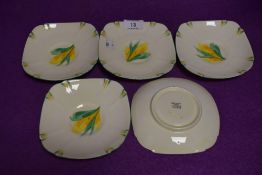 A set of five tea saucers by Paragon with hand decorated designs