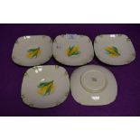 A set of five tea saucers by Paragon with hand decorated designs