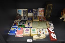 A selection of poker and playing cards including bridge and poker dice