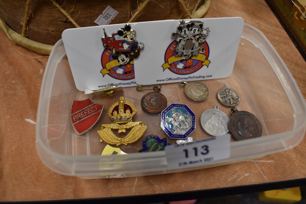 A selection of enamel and similar pin badges including religious and Disney interest