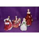 A selection of Royal Doulton figurines including small sizes and larger Fragrance