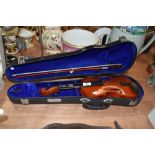 A modern musical violin in hard bodied case