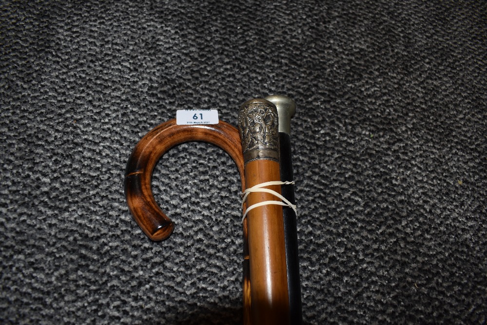 A selection of walking stick and cane including Chinoserie handled cane