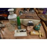 A selection of curios and trinkets including Cognac decanter and golf score wristwatch