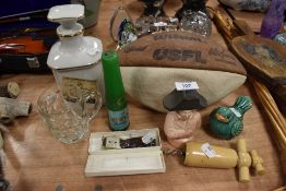 A selection of curios and trinkets including Cognac decanter and golf score wristwatch