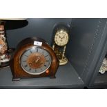 An art deco mantle clock and similar anniversary domed clock