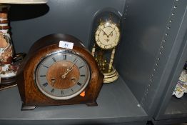 An art deco mantle clock and similar anniversary domed clock