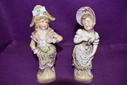 Two vintage classically dressed figurines of a boy and a girl.AF.