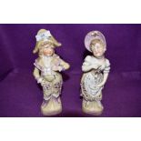 Two vintage classically dressed figurines of a boy and a girl.AF.