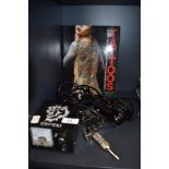 A selection of tattoo equipment and similar book