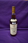 A bottle of The Macallan 10 Year Old Single Highland Malt Scotch Whisky, matured in sherry wood,