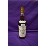 A bottle of The Macallan 10 Year Old Single Highland Malt Scotch Whisky, matured in sherry wood,