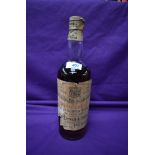 A 1929 bottle of John Dewar and Sons White Label Finest Scotch Whisky of Great Age with spring