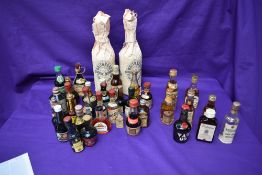 A selection of miniatures including Booths Finest Dry Gin 70% Proof, Balentines Whisky no strength