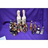 A selection of miniatures including Booths Finest Dry Gin 70% Proof, Balentines Whisky no strength