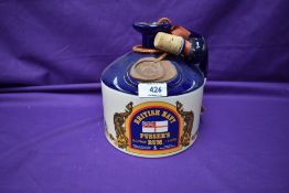 A Ceramic Decanter of British Navy Pussers Rum, with stopper, British Virgin Islands. 1 litre, 95.