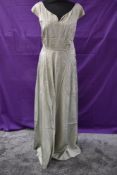 A 1940s pale green full length watered taffeta dress, having side hook and eye fastening.