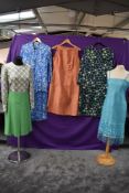 A mixed lot of vintage dresses including two brightly patterned 1960s dresses, medium to larger