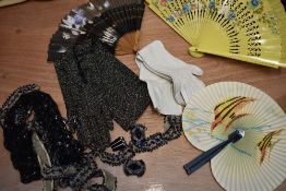 A mixed box of vintage and antique beaded sections,an art deco buckle, three fans and two pairs of
