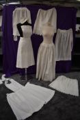 A mixed selection of vintage and antique petticoats and aprons also included is a tea house/ maids