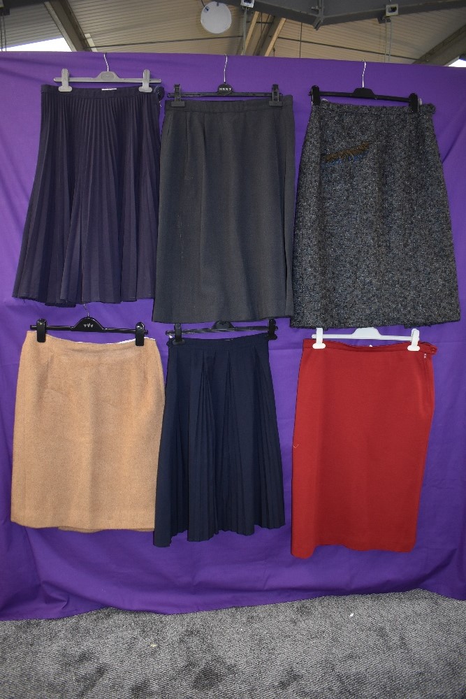 Six vintage skirts mainly 1950s to 1960s, pleated and classic styles, mixed fabrics and sizes.