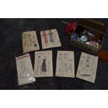 A tin of haberdashery and six 1930s and 40s patterns including nightwear, lingerie and dresses.