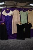 A collection of predominantly 1960s maxi dresses and day dresses, mixed sizes and styles.