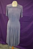 A 1930s/1940s vintage mauve crepe day dress accented with blue edging to bodice and sleeves,
