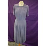 A 1930s/1940s vintage mauve crepe day dress accented with blue edging to bodice and sleeves,