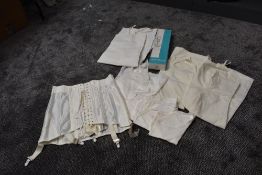 A selection of ladies vintage lingerie including girdle in box,slips and petticoats.