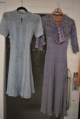 Two vintage dresses,including 1940s pale blue dress,both extra small sizes with some staining and