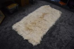 A large retro Mongolian goatskin rug.