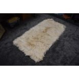 A large retro Mongolian goatskin rug.